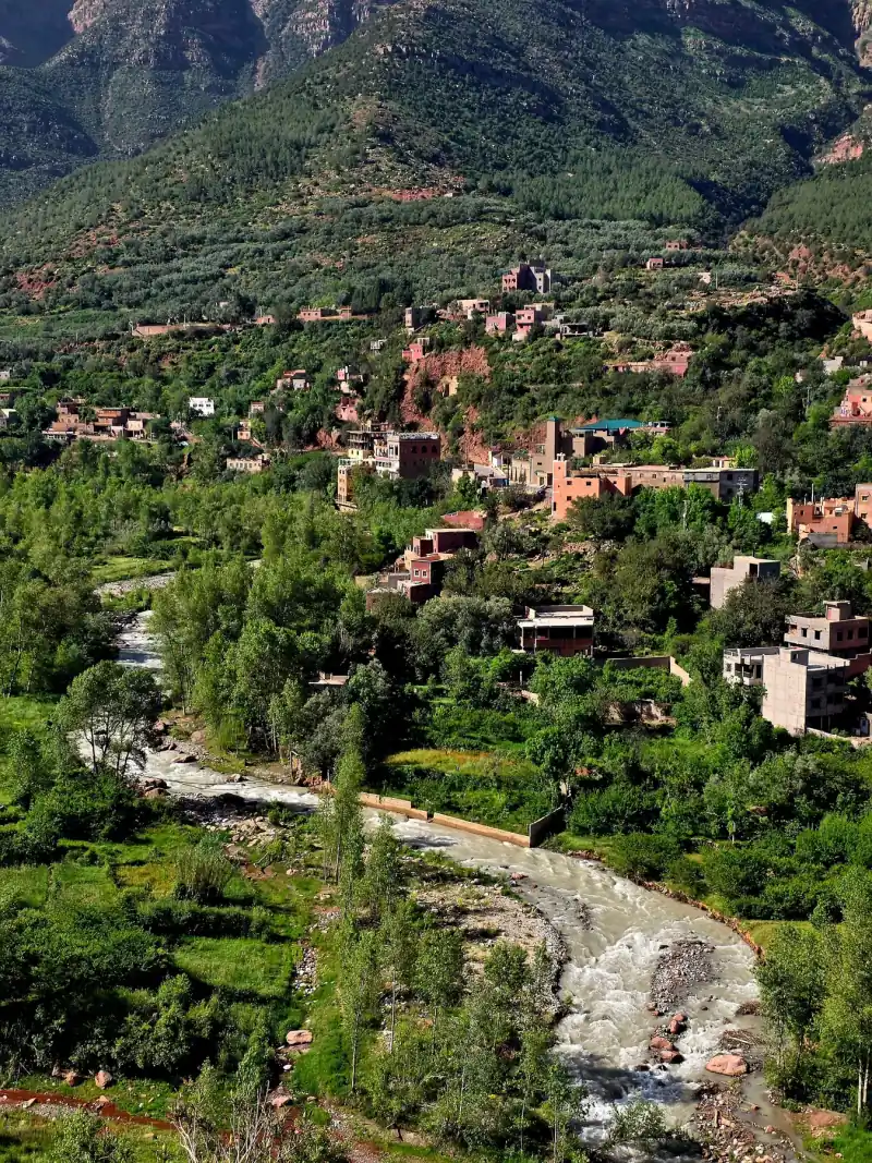Green Atlas Mountain valley with a river and hillside villages